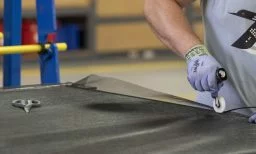 Man assembling a door screen